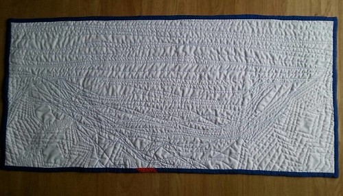 The back of the #penguinsinthesewingroom runner is just plain white, but shows off the texture from the quilting quite nicely. No wonder it took almost two bobbins! It's 17" x 36".