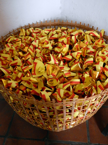 Paper wishes in a basket in a Chinese temple in Penang, Malaysia