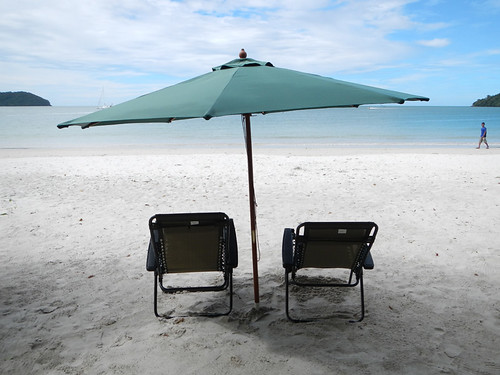 Empty Beach Chairs and Umbrella on the beach in Langkawi, Malaysia