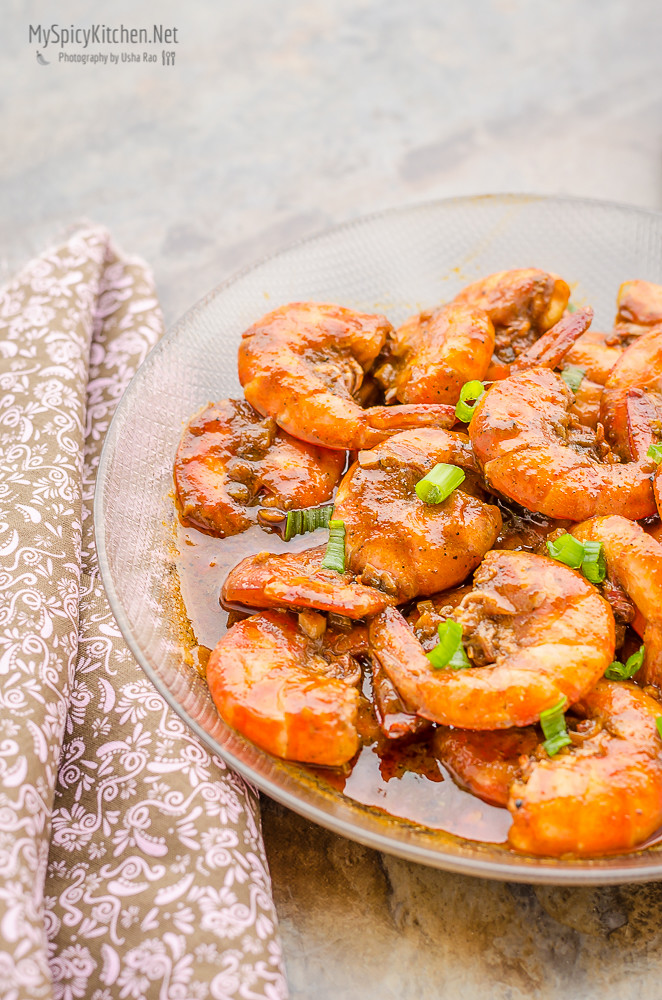 Bowl of bbq shrimp with sauce.