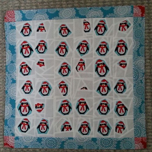 Penguins! In the end, I went for the turquoise border with red corners (thanks for the idea, @suzanneyerks!) as it turned out I didn't have enough red to do much of anything without piecing it together. I used more than I realised on the polar bears and,