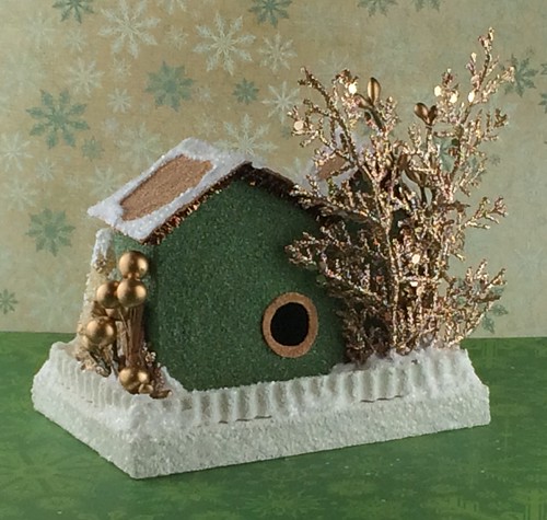 green and brown Putz house with copper embellishments