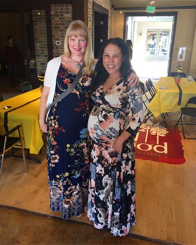 A couple of happy pregnant ladies in florals. We are due 2 weeks apart, with boys.