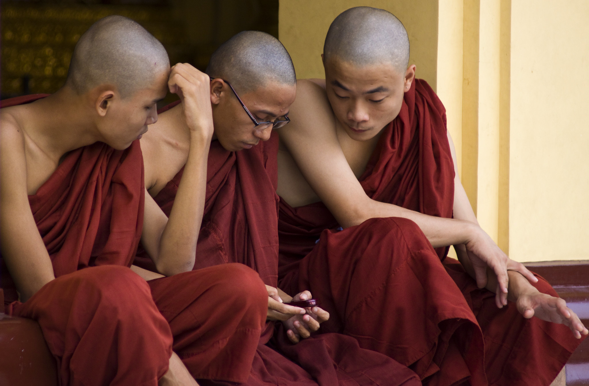Burmese Monks Distracted By Modern Technology