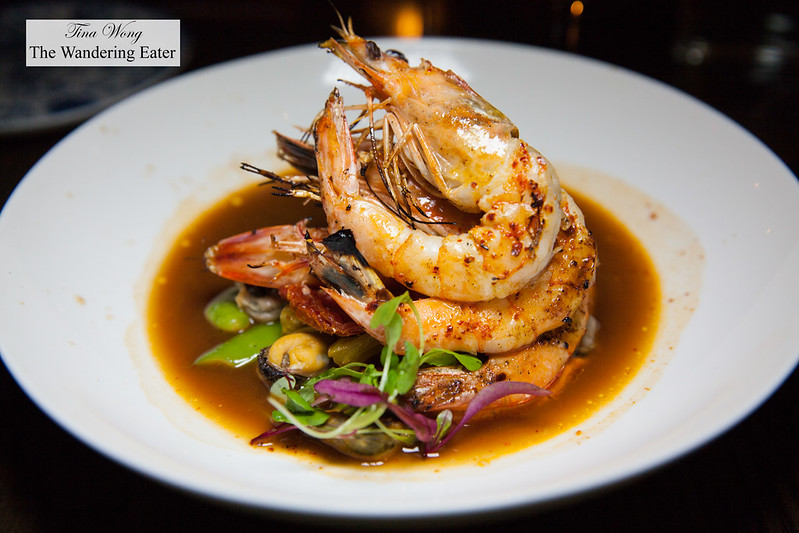 Grilled jumbo prawns with ramps, fava beans, fennel, saffron, mussels, cockles, lobster broth