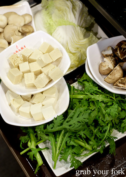 Oyster mushrooms, Chinese cabbage, fresh mushrooms, tong ho chrysanthemum leaves, fresh tofu and frozen tofu at Shancheng Hotpot King, Sydney