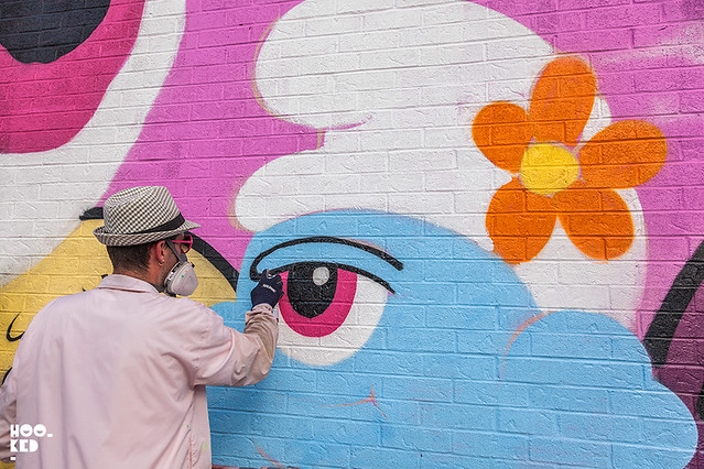 Artist Buff Monster's at work Seven Deadly Sins wall for Mural Festival