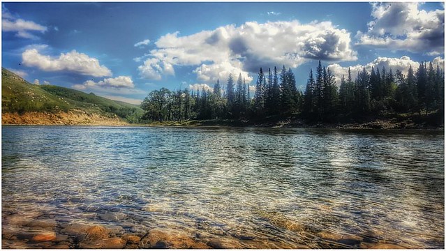 Rest is not idleness, and to lie sometimes on the grass under trees on a summer's day, listening to the murmur of the water, or watching the clouds float across the sky, is by no means a waste of time. -- John Lubbock #albertaparks #explorealberta #glenb