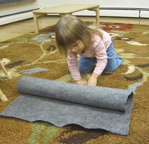 rolling up her mat
