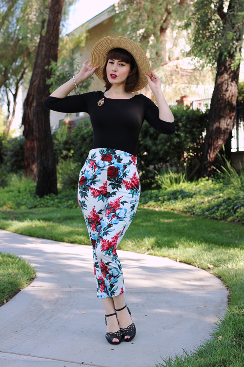 Pinup Girl Clothing Sabrina Top in Black Laura Byrnes High Waisted Cropped Trousers in White and Red Floral Erstwilder Have A Hoot Brooch