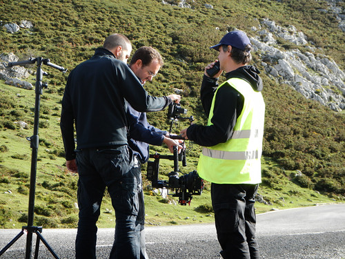 Filming a motorcycle commercial on the winding roads of the mountainous region of Covadonga, Spain