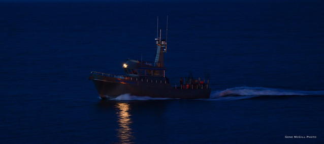 Fishing vesssel returning late to port in Homer