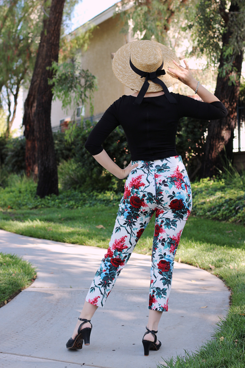 Pinup Girl Clothing Sabrina Top in Black Laura Byrnes High Waisted Cropped Trousers in White and Red Floral Erstwilder Have A Hoot Brooch